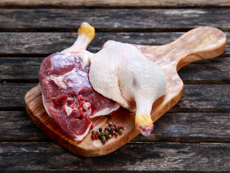 Free,Range,Duck,Legs,With,Herbs.,On,Old,Wooden,Table